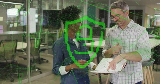 Male explaining while female reviewing folder in business, folder review causing green lock overlay