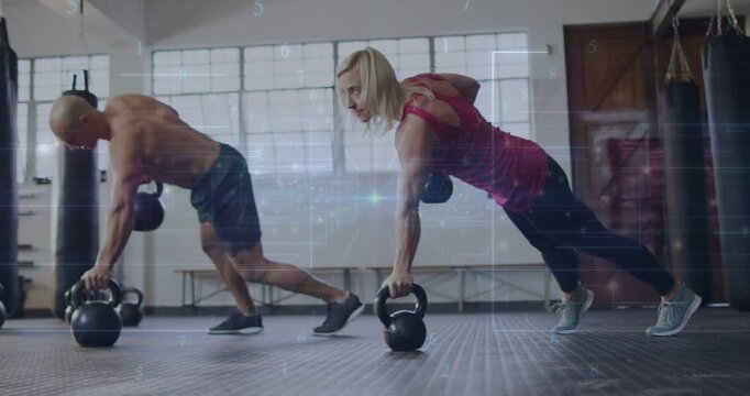 Vertical video: Planking left shirtless and right red top rowing kettlebells for core in gym