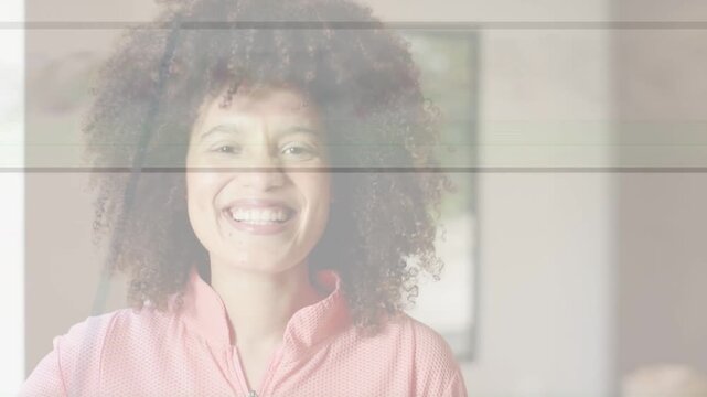 Vertical video: Woman reacting offscreen prompt in home, smiling, blinking for content, scanlines