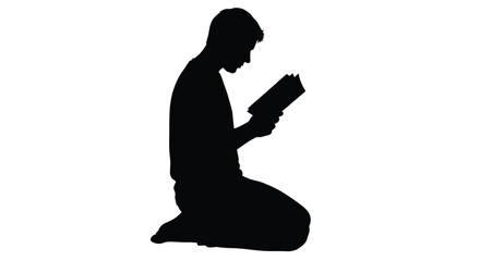 A person kneeling and reading a book in stark contrast silhouette