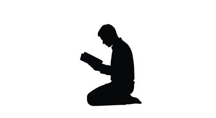 A man kneeling and reading a book striking black silhouette