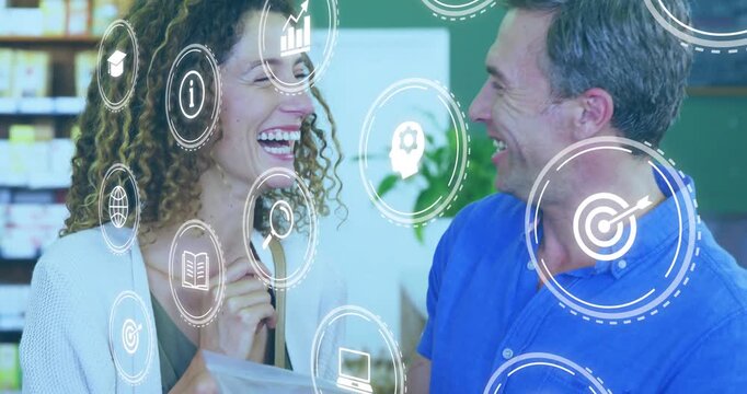 Retail couple holding pouch, man pointing label causing icons overlaying faces, checking details