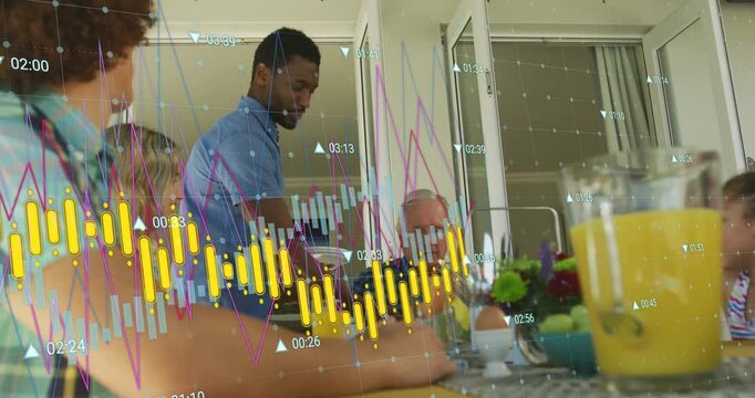 Standing man bringing plates to table, serving breakfast while finance charts overlaying tabletop