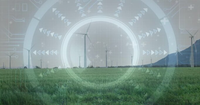 Wind turbines spanning grassy plain receiving sensor input HUD overlay mapping green energy output