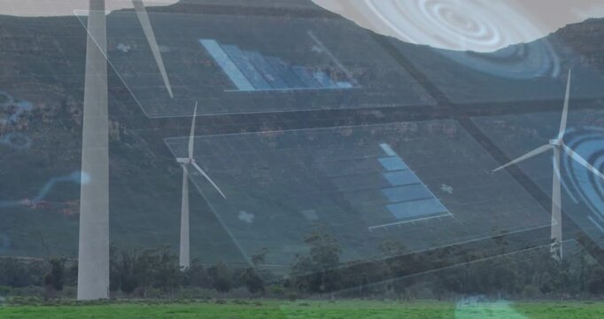 Turbines rotating in grass, blue-bar spiral UI rising opacity as live data streaming showing energy