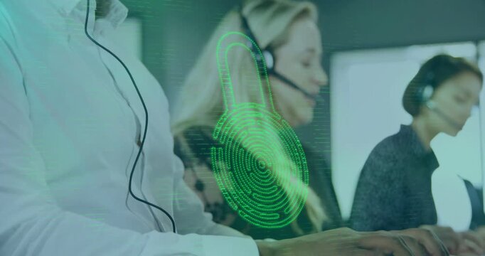 Seated male agent typing and adjusting mic in call center, causing biometric padlock authenticating