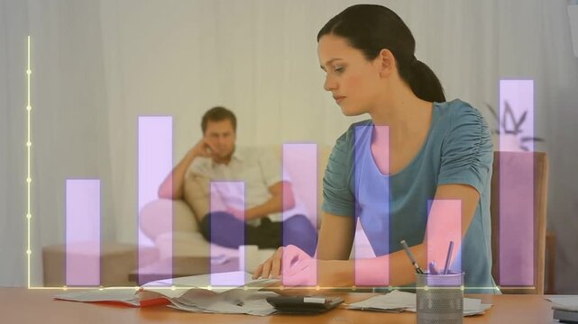 Holding head, reaching calculator, woman sorting papers, tapping numbers, writing managing bills