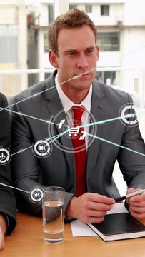 Vertical video: Manager at meeting, rings forming cart graph sweeping chest, showing retail data