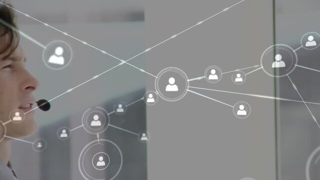 Animation of networks of connections with icons over businessman using phone headsets