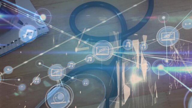 Animation of network of connections with icons over doctor stethoscope on desk