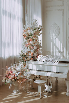 White Grand Piano in Elegant Sunlit Interior