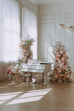 White Grand Piano in Elegant Sunlit Interior