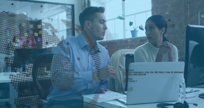 Man pointing printout and woman checking laptop in tech office sparking map overlay guiding choice