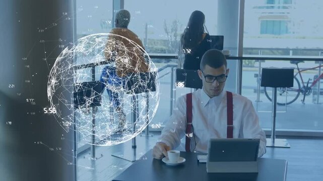 Animation of illuminated numbers and globe over man drinking tea and working on laptop