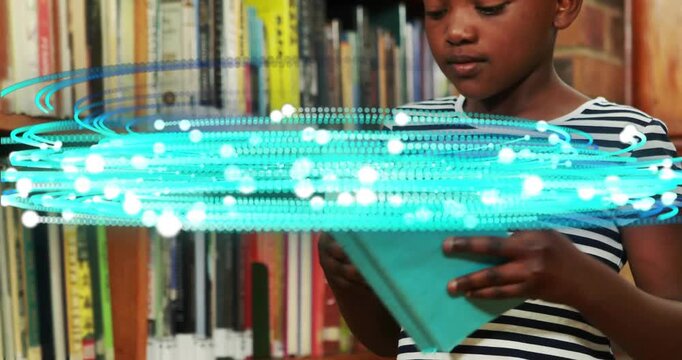 Child reading book in library with digital data animation overlay