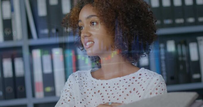 Vertical video: Hearing offframe cue woman in eyelet top speaking and pointing at binder at desk