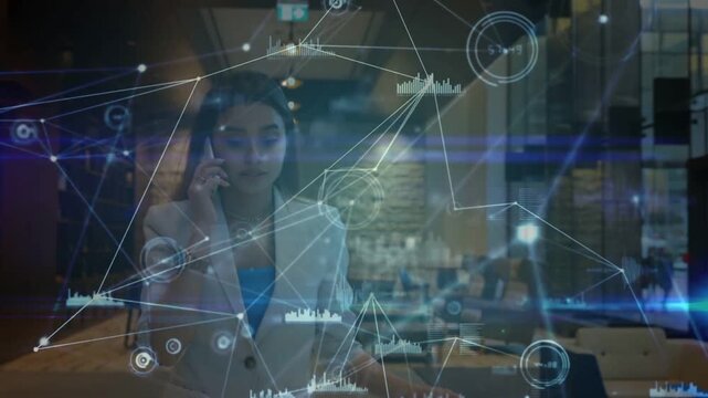 Tech exec on phone walking lobby while holo overlay appearing around her, highlighting data on call