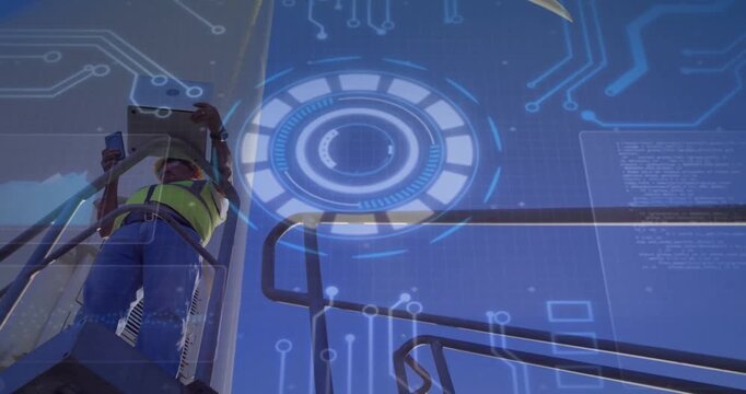 Vertical video: Tech raising tab on lift starting HUD scanning of turbine hub and blade for repair