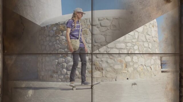 Vertical video: Skater pushing off, rolling along wall, rail to sea for fun, travel film flickering