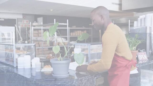 Vertical video: Finishing setup marble counter, barista turning to camera, welcoming bakery guests