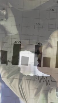 Vertical video: Auto tech raising hand inspecting roof unit as charts clearing and numbers rising