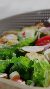 Vertical video: Dotted overlay appearing while camera shifting, revealing salad for culinary use