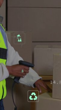 Vertical video: Warehouse worker raising scanner, scanning labels for inventory, showing CO2 icons