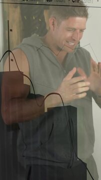 Vertical video: Man clapping, miming on set causing finance graph with rates to show market trends