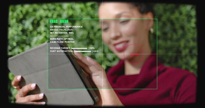 Woman tapping tablet and swiping, reviewing finance KPIs on EXEC DASH HUD while aligning red target