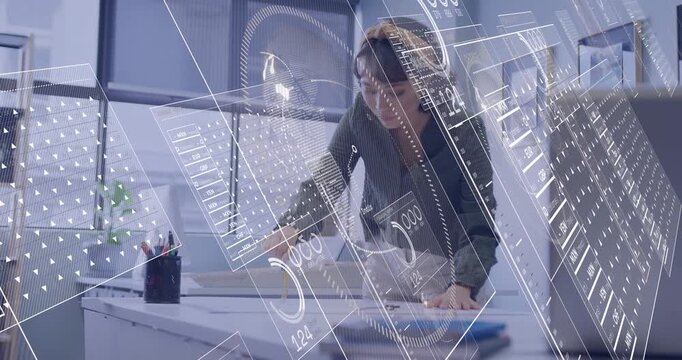 Designer picking up pencil marking plans drafting table HUD overlays floating helping refine design