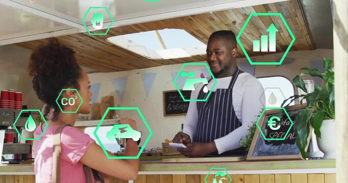 Woman showing watch and placing food order at kiosk, vendor writing pad while hex icons overlaying