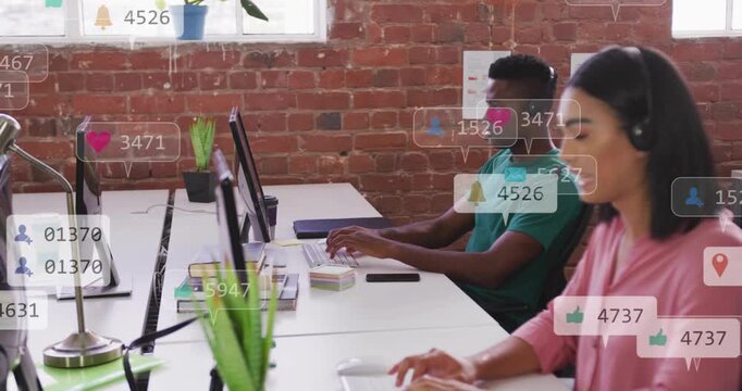 Two agents typing and speaking at shared desk, incoming marketing alerts spawning icons and counts