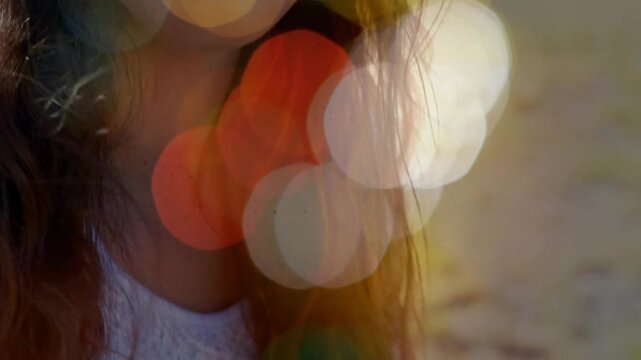 Female teen musician playing guitar, zooming out revealing smile while promoting music with bokeh
