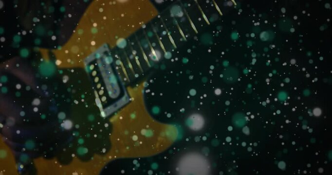 Yellow guitar revealing body, camera shifting, teal bokeh drifting, faint hand hinting music