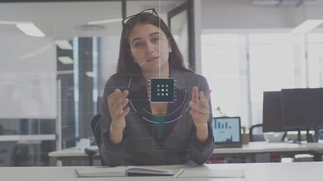 Female office professional bringing hands together at desk, manipulating HUD 3x3 grid for business