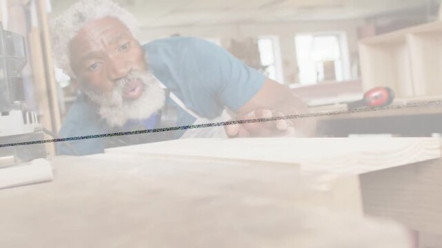 Vertical video: Placing board, man leaning in workshop, checking fit with fingers, router, apron