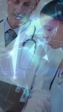 Vertical video: Tablet pinging, doctor and nurse viewing scan under globe overlay, discussing care