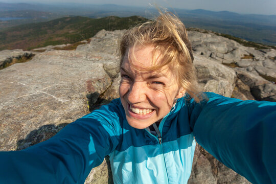 Selfie of a young blond caucasian woman atop Mount Monadnock