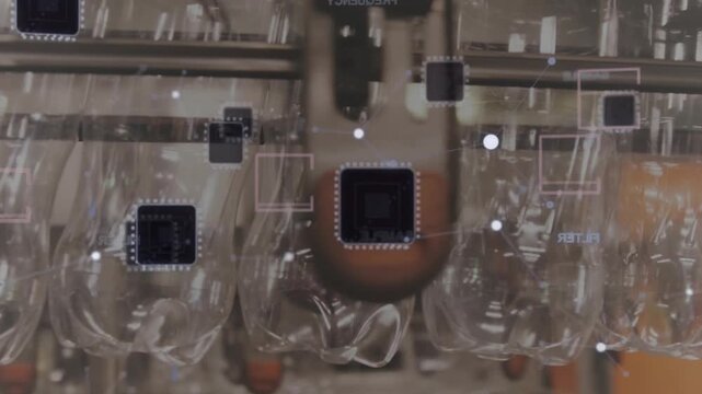 Conveyor starting moving bottles along rail while overlays tracking and nozzle inspecting quality