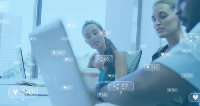 Man tapping laptop starting overlays, team leaning, showing rising engagement and forming consensus