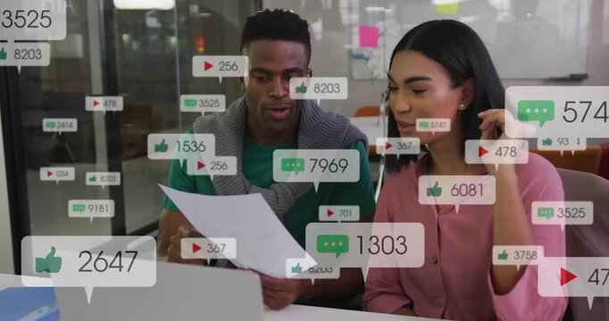Man and woman pair leaning in, reading paper and laptop, overlays appearing, monitoring marketing
