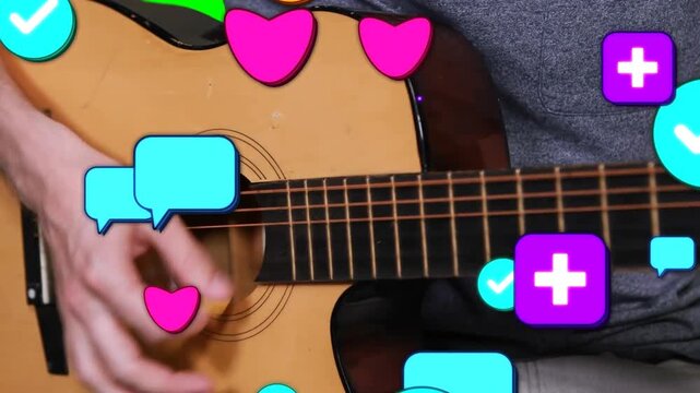 Right hand picking strumming acoustic guitar in studio in gray shirt icons popping seeking likes