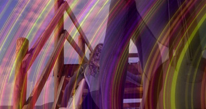 Surfer with board nearing stairs, grabbing rail and climbing to deck while streak obscuring board