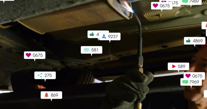 Vertical video: Tech using torch under car, causing alert bubbles growing across exhaust for repair