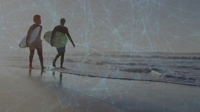 Woman and man carrying boards walking to ocean scouting waves, travel overlay layering over sand