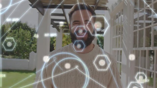 Vertical video: Man standing on porch, hexagons rising, aligning over face, squinting, showing tech
