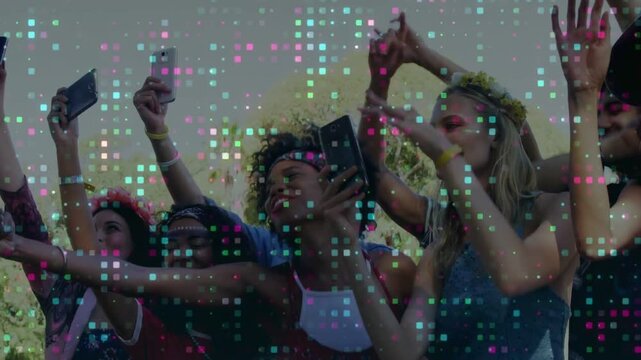 Festival crowd recording phones at railing, reacting to offstage show, dancing under pixel overlay