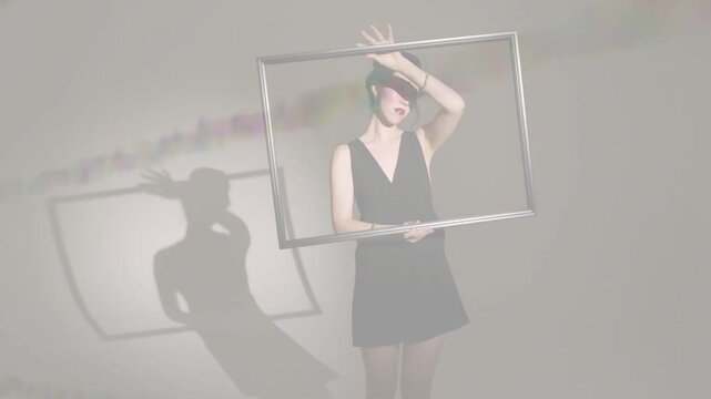 Vertical video: Beam hitting wall woman turning frame framing face shadow mirroring camera closing