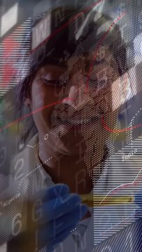 Vertical video: Lab scientist after cue pipetting for analysis with data overlay obscuring face