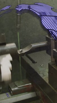 Vertical video: Lathe rotating and tool feeding, starting globe overlay and labels mapping output